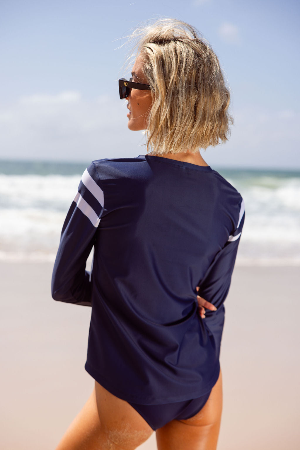 Back view of navy Perfect 10 UPF50+ rashguard in Italian premium fabric