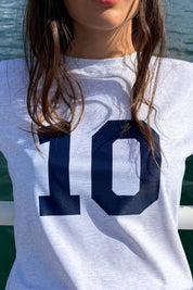 Close-up of the ACQUA Perfect 10 UPF50+ rashguard in grey marle with navy ‘10’ print.