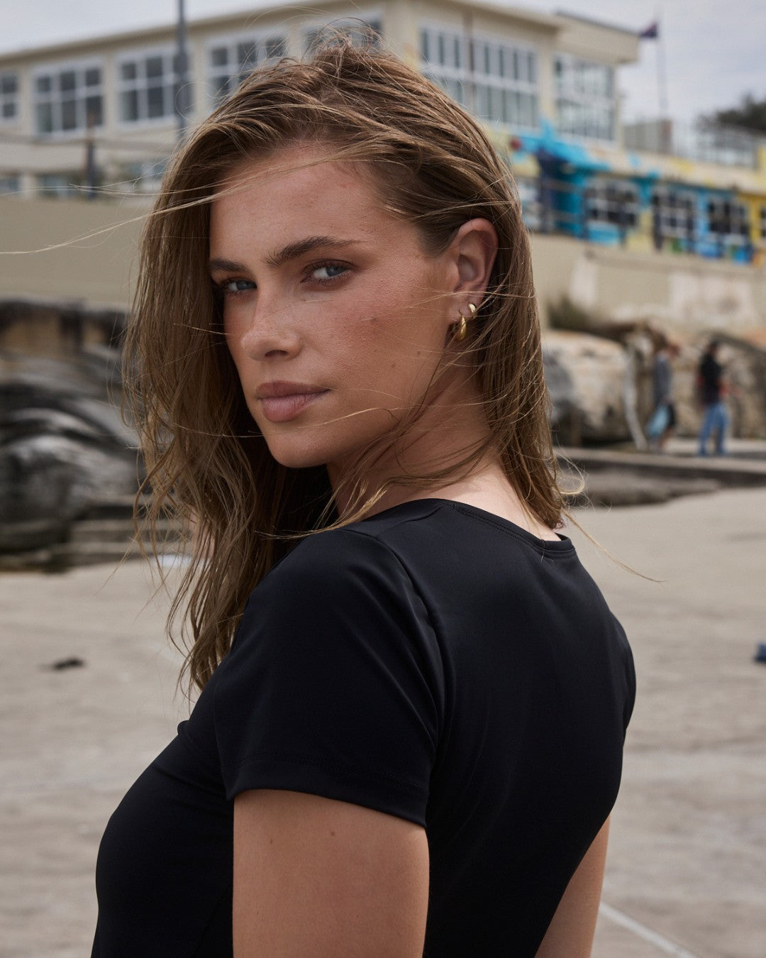 Close up of eco-friendly black swim tee rashguard with chlorine and sunscreen resistance