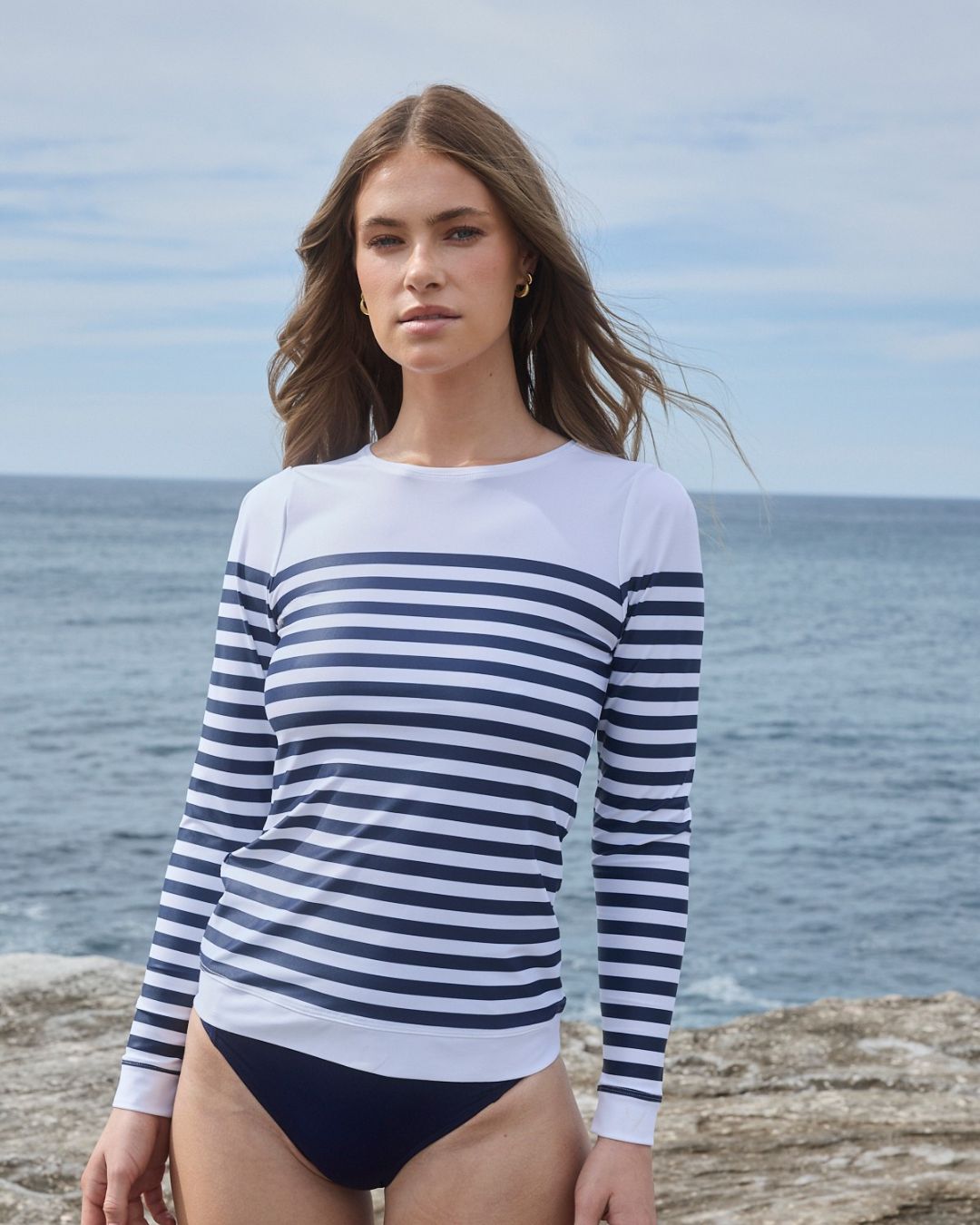 White nautical rashguard with navy stripes, front view