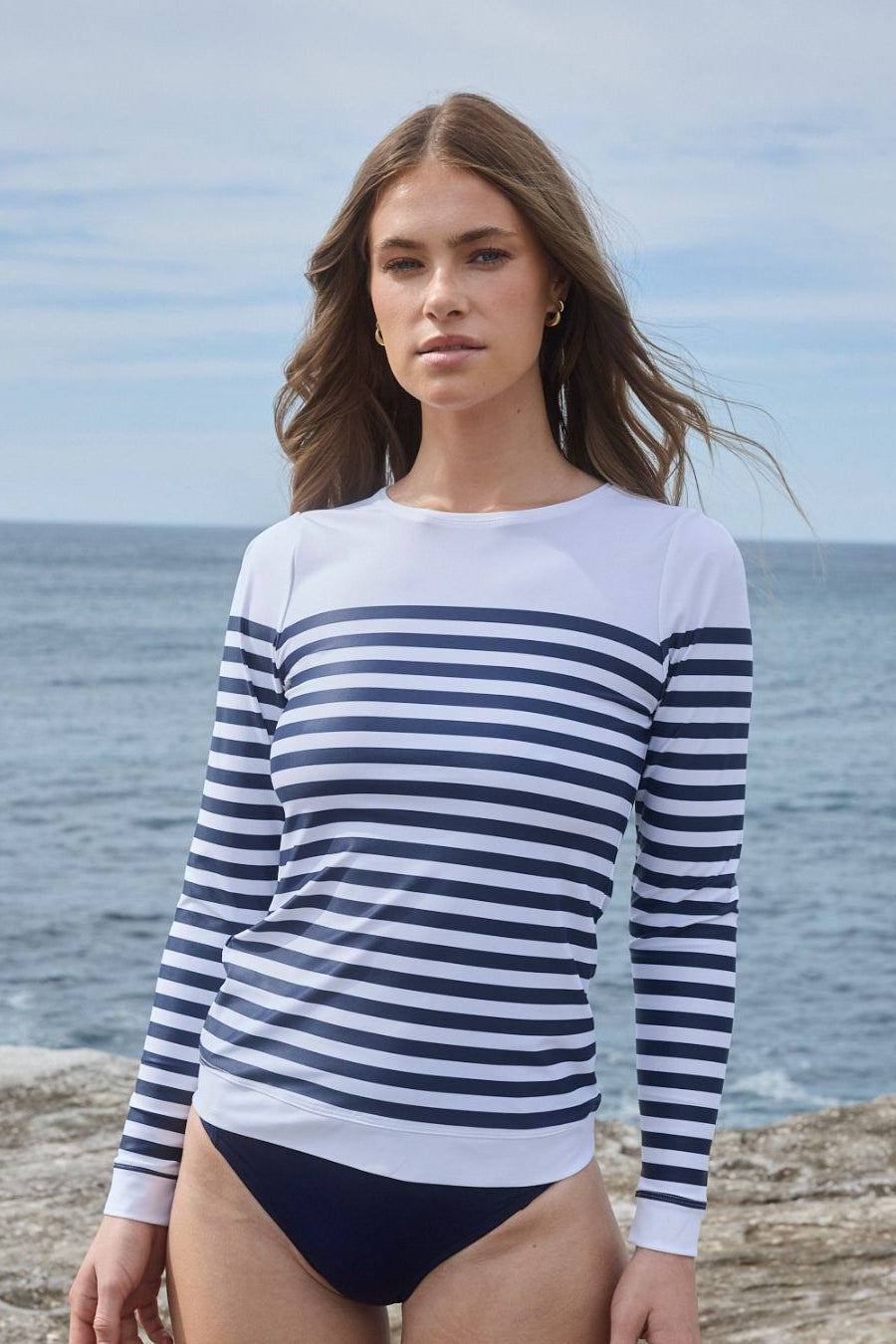 White nautical rashguard with navy stripes, front view