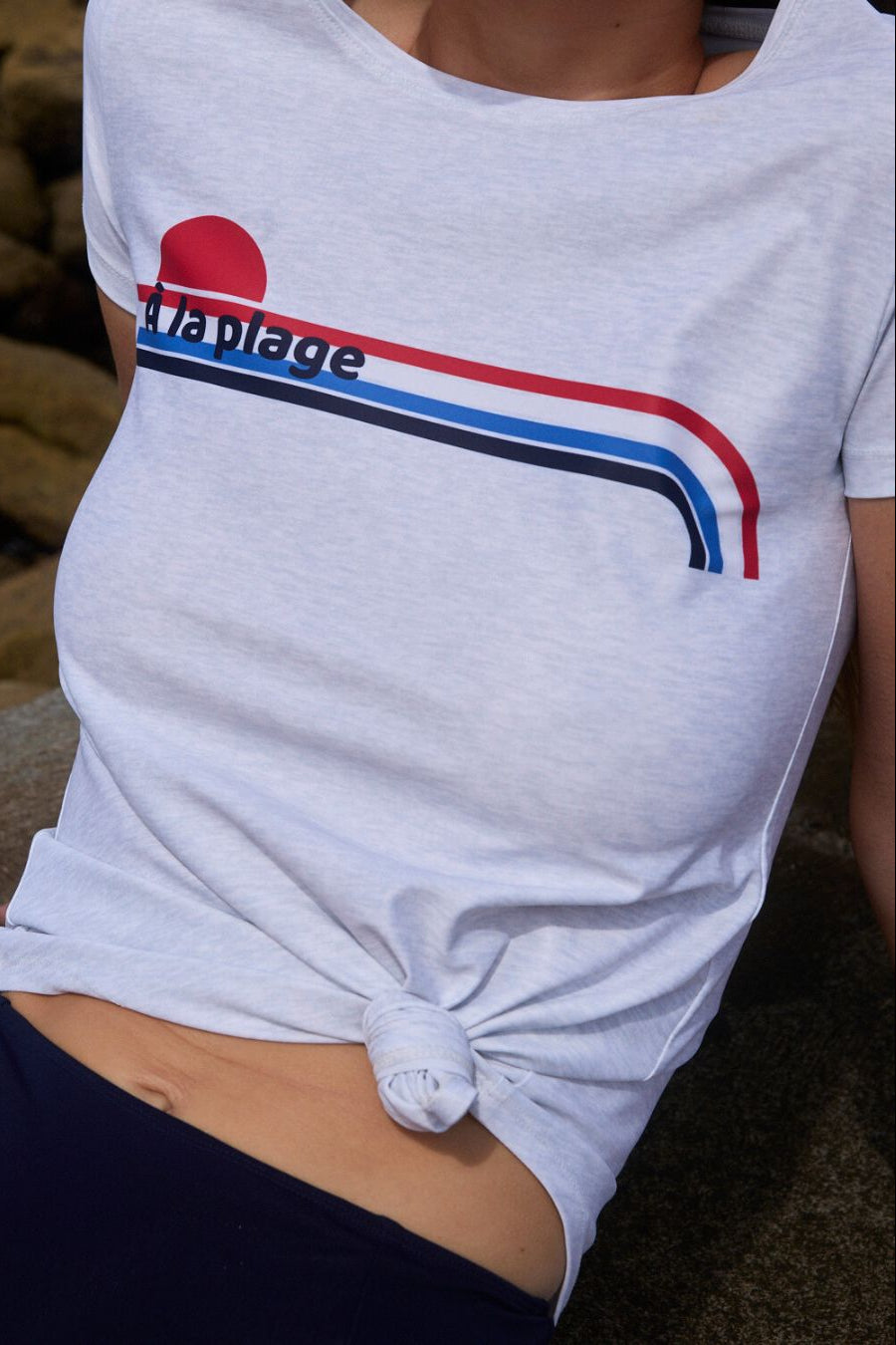Detail shot of À La Plage print on chlorine-resistant swim tee