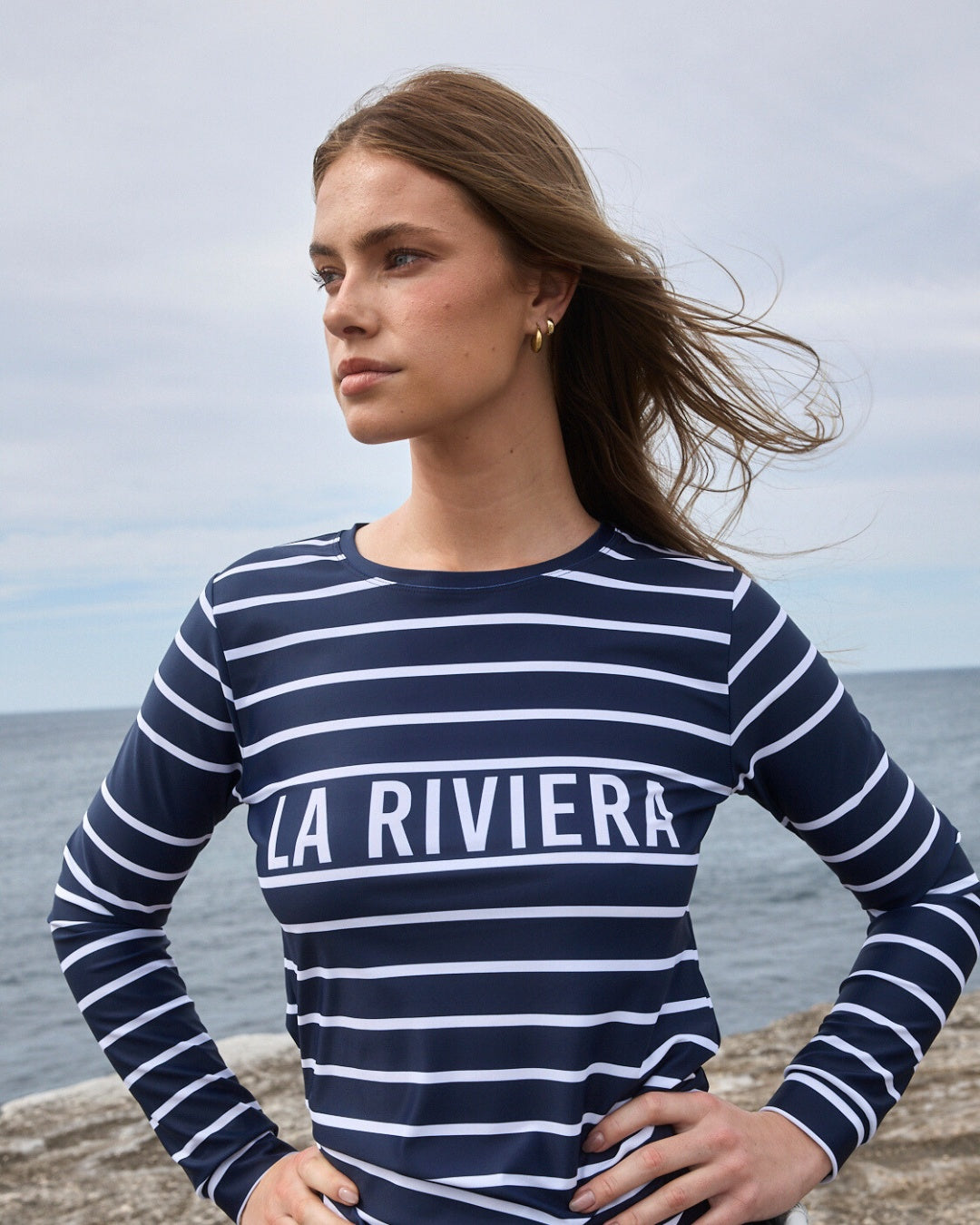 La Riviera rashguard lifestyle shot UPF50+ navy striped womens sun protection swimwear