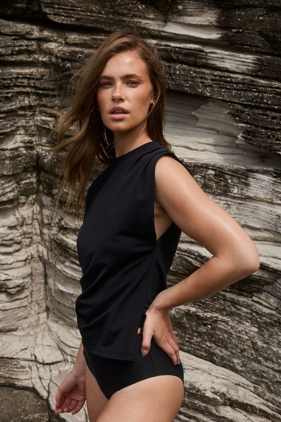 Black swim tank showcasing relaxed fit and movement