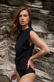 Black swim tank showcasing relaxed fit and movement